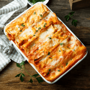 Our Classic Lasagna Bolognese: Served with Garlic Bread and Caesar salad-Housemade Dressing, Focaccia Croutons - The Chef's Garden